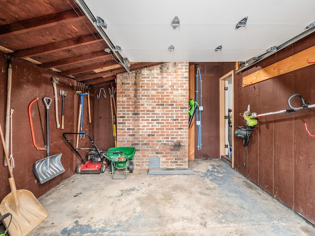 garage with wood walls