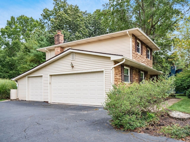 view of home's exterior featuring a garage