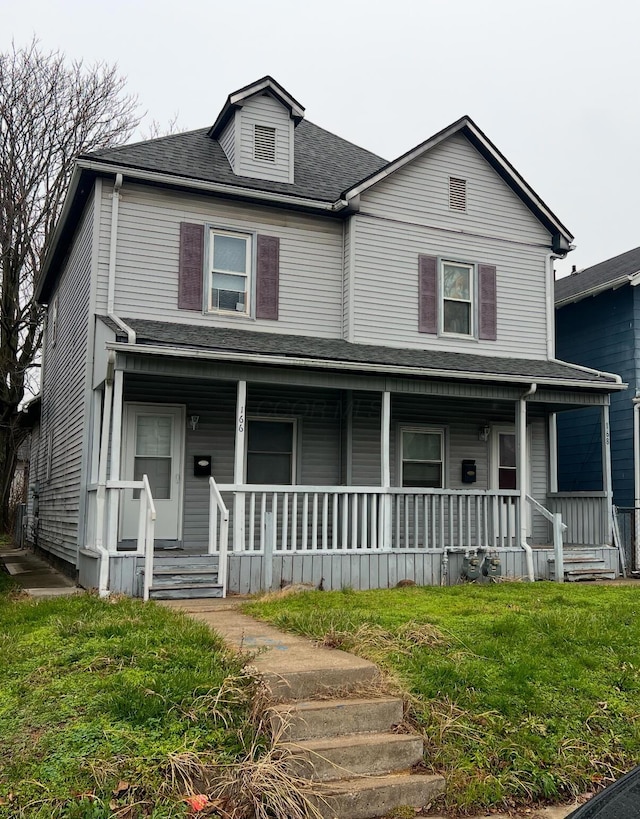 view of front of house featuring a porch and a front lawn