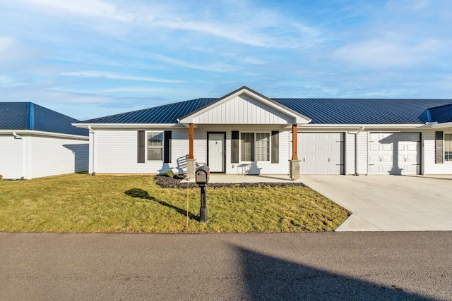 ranch-style home with covered porch, a garage, and a front yard