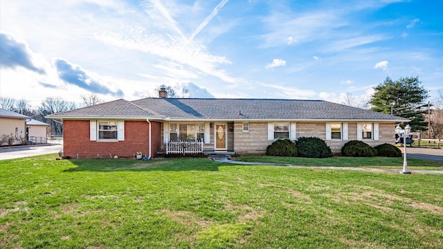 single story home with covered porch and a front lawn