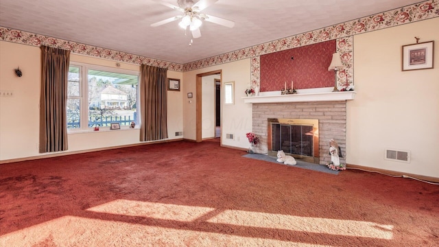 unfurnished living room featuring a textured ceiling, ceiling fan, carpet flooring, and a fireplace