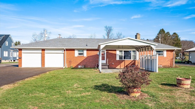 single story home with a front lawn and a carport