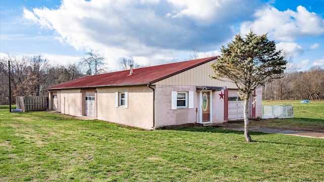 single story home with a front lawn and a garage