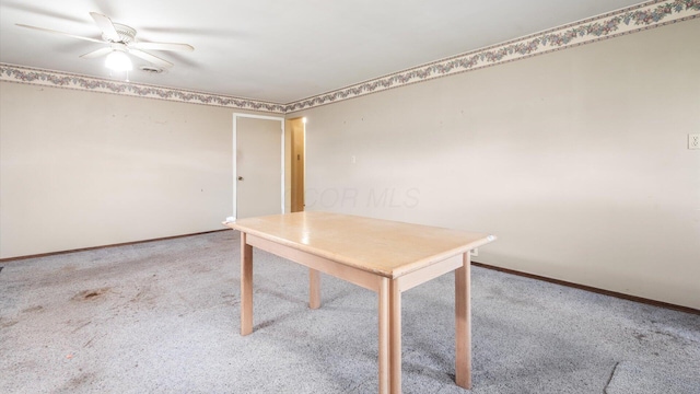 unfurnished office with carpet flooring and ceiling fan