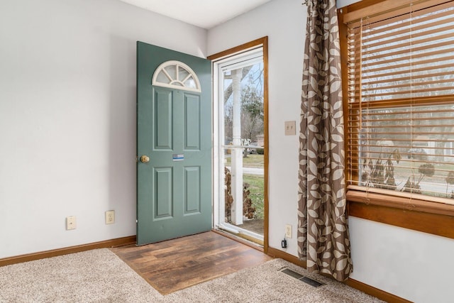 entryway featuring carpet flooring