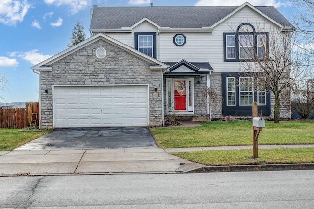 view of front property featuring a front yard and a garage