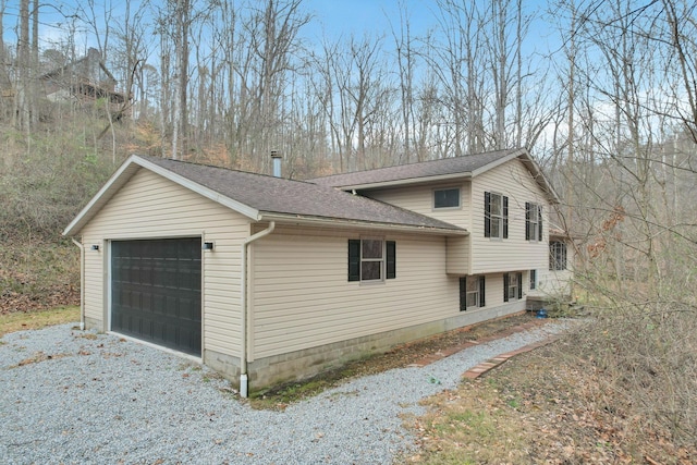 view of side of property with a garage