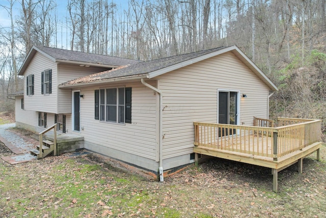 view of home's exterior featuring a deck