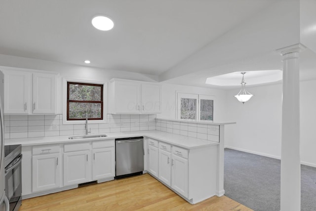 kitchen featuring dishwasher, white cabinetry, sink, and decorative light fixtures