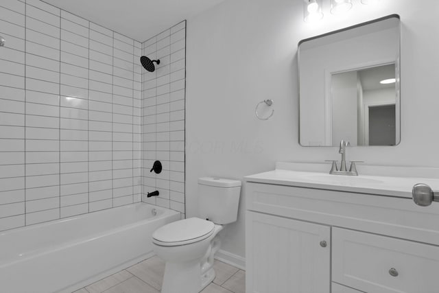 full bathroom featuring vanity, tile patterned floors, tiled shower / bath combo, and toilet