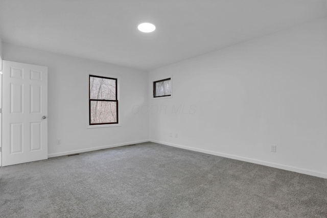 unfurnished room featuring carpet floors