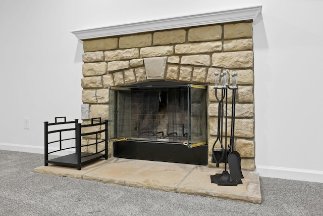 interior details with carpet and a stone fireplace