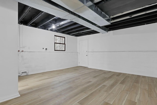 basement featuring light wood-type flooring