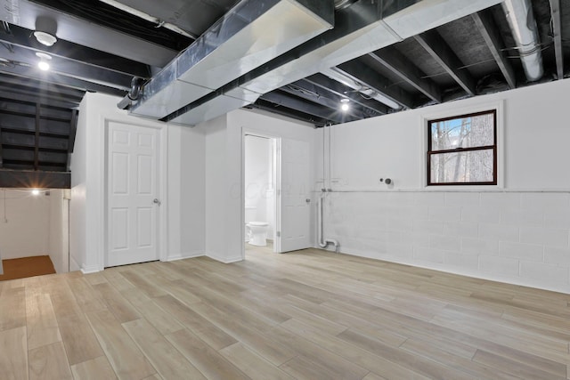 basement featuring hardwood / wood-style floors