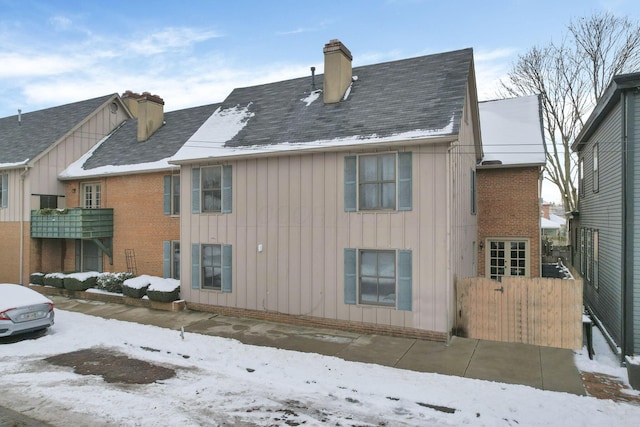 view of snow covered house