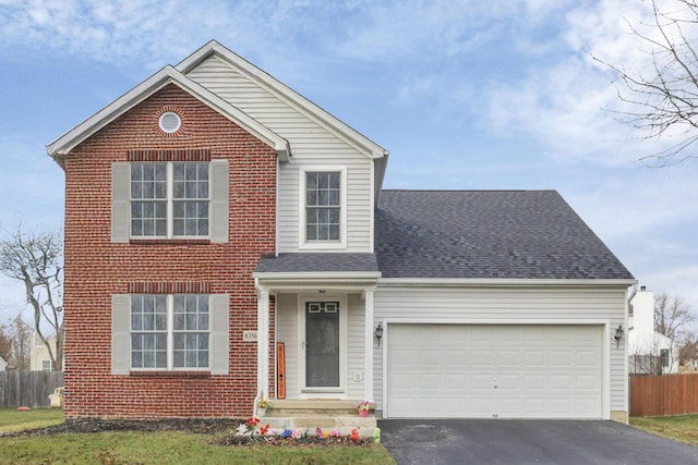 front of property with a garage