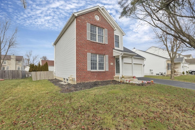 view of front property featuring a front yard and a garage