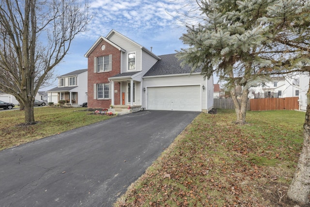 front facade featuring a front yard and a garage