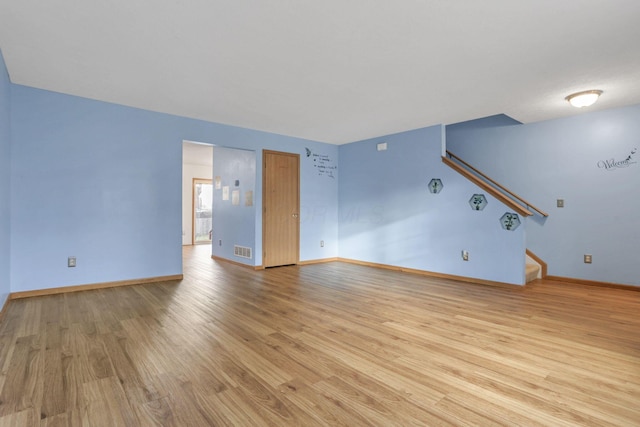 unfurnished living room featuring light wood-type flooring