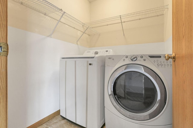 laundry area featuring light tile patterned floors