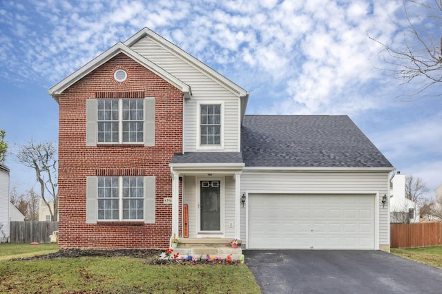 front facade featuring a garage and a front lawn