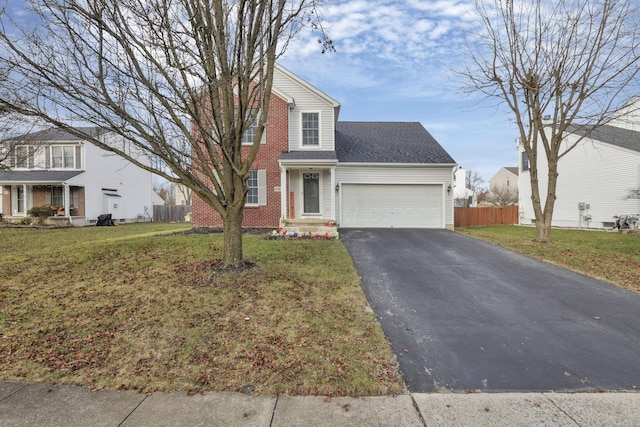 view of front of home with a garage and a front lawn