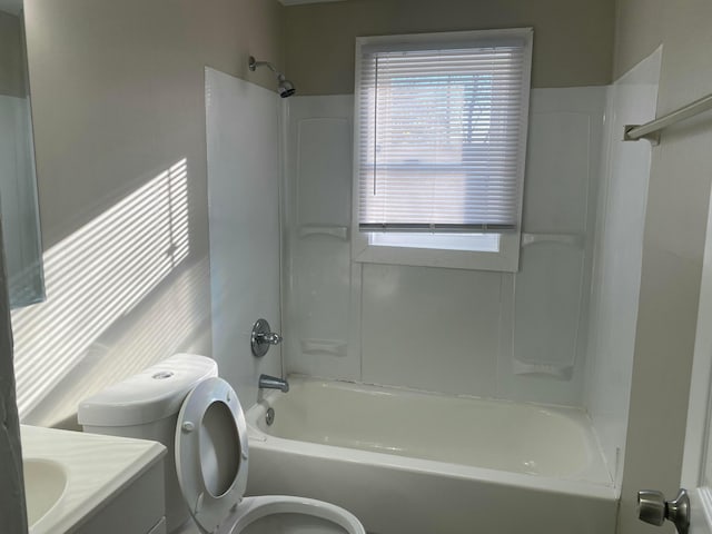 full bathroom with shower / bathing tub combination, vanity, and toilet