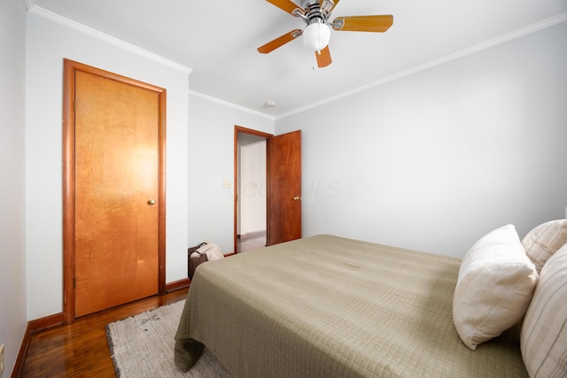 bedroom featuring ceiling fan, hardwood / wood-style floors, and crown molding