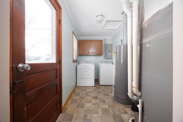 laundry area with cabinets, washing machine and dryer, water heater, electric panel, and crown molding