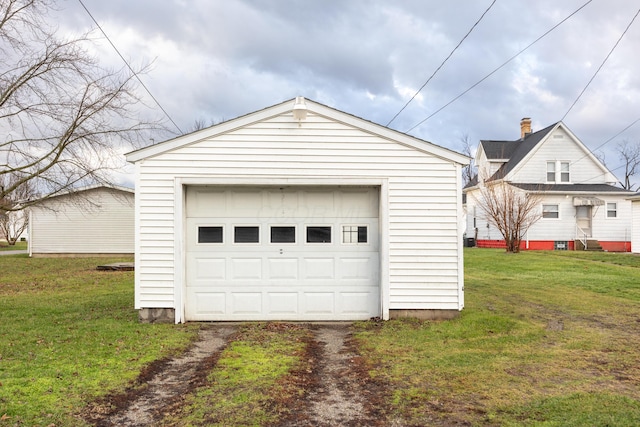 garage featuring a lawn