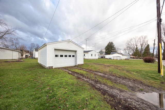 garage featuring a yard