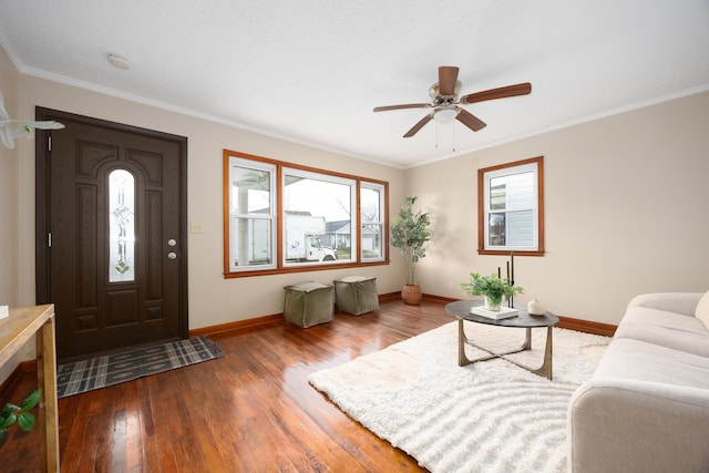 living room featuring wood-type flooring, ceiling fan, and ornamental molding