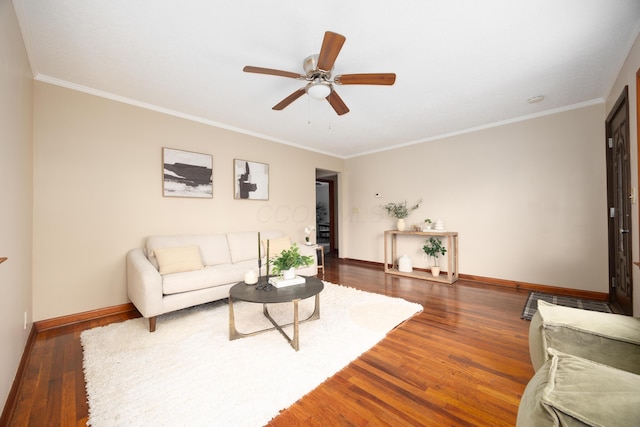 living room featuring dark hardwood / wood-style flooring, ceiling fan, and ornamental molding