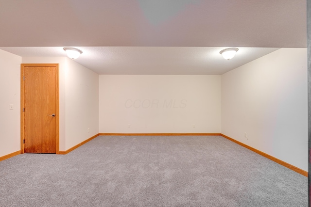 bonus room with carpet flooring