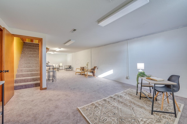 sitting room featuring light colored carpet