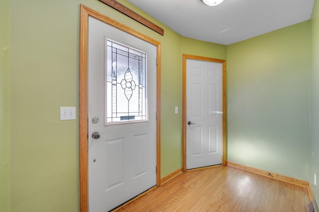 entrance foyer with light hardwood / wood-style flooring