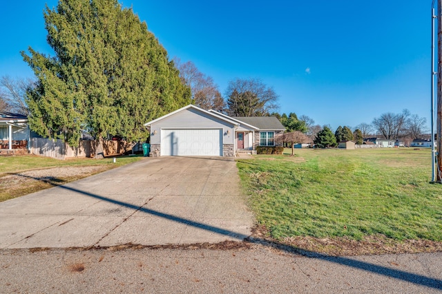 ranch-style house with a garage and a front lawn