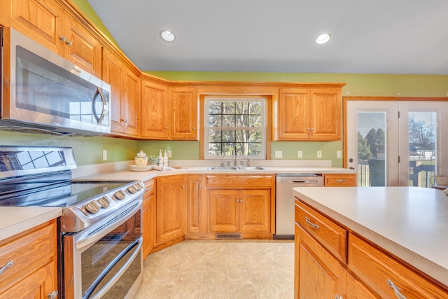 kitchen with a healthy amount of sunlight, sink, and stainless steel appliances