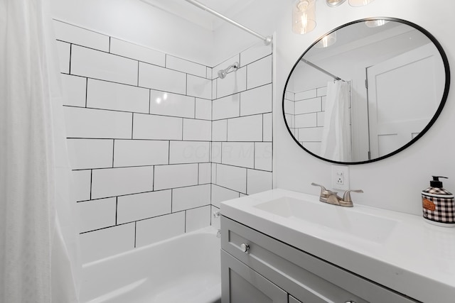 bathroom featuring shower / bath combo and vanity