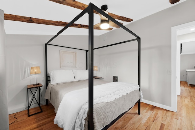 bedroom with hardwood / wood-style floors and ceiling fan