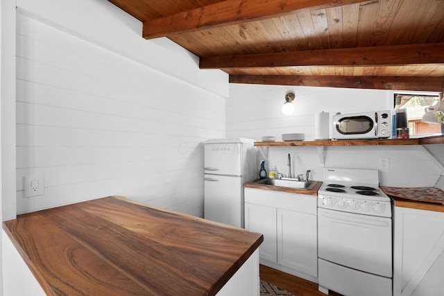 kitchen with sink, wooden ceiling, beamed ceiling, white appliances, and white cabinets