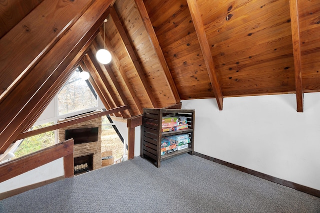 bonus room with a fireplace, lofted ceiling with beams, carpet floors, and wooden ceiling