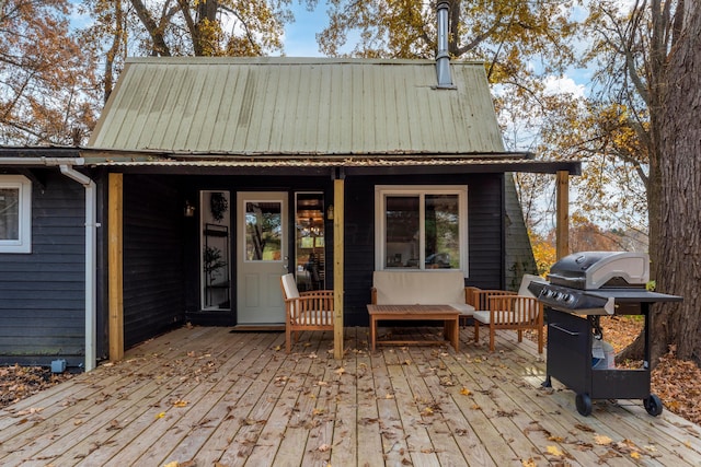 wooden deck featuring area for grilling