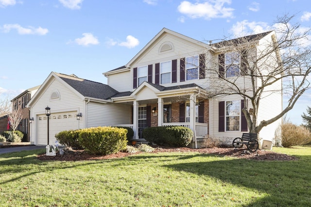 front facade featuring a front yard, a porch, and a garage