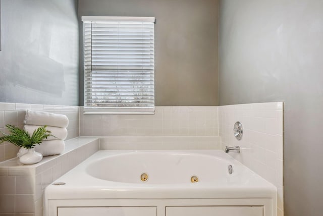 bathroom featuring a tub to relax in