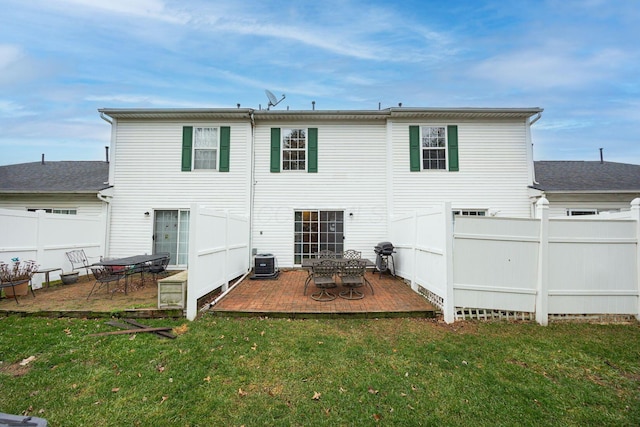 rear view of property featuring a patio area, a yard, and central AC unit