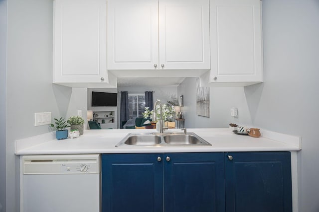 bar with blue cabinetry, dishwasher, white cabinets, and sink