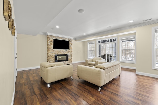 living room featuring a fireplace, dark hardwood / wood-style floors, and ornamental molding