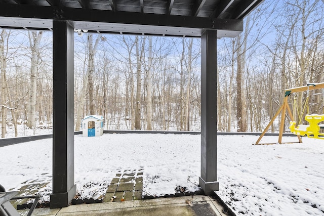 view of yard layered in snow